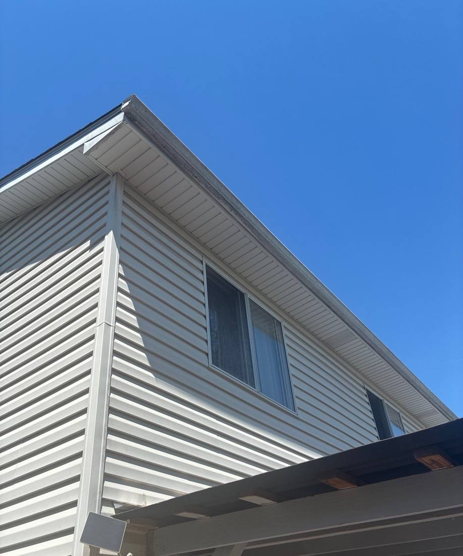 Siding and roofline detail on a Bolingbrook home, May 2026