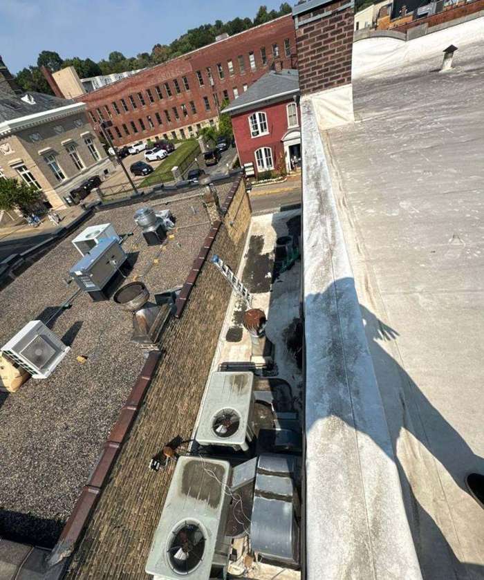 View across downtown Stillwater rooftops toward Main Street's historic brick buildings, September 2024