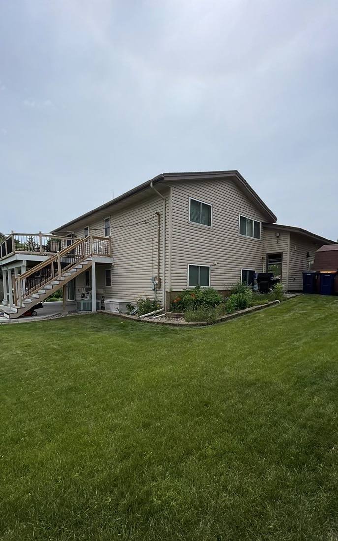 Rear elevation of a Rosemount home photographed during a roof project, July 2023