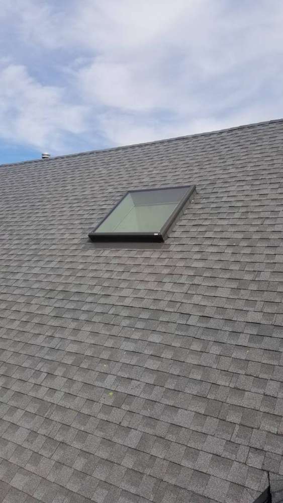 Skylight set into a gray shingle roof on a Champlin, MN home, October 2018
