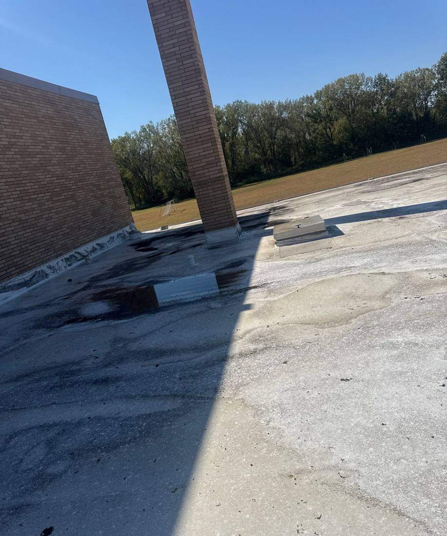 Roof edge and parapet wall above the athletic field at Minnetonka Christian Academy, September 2025