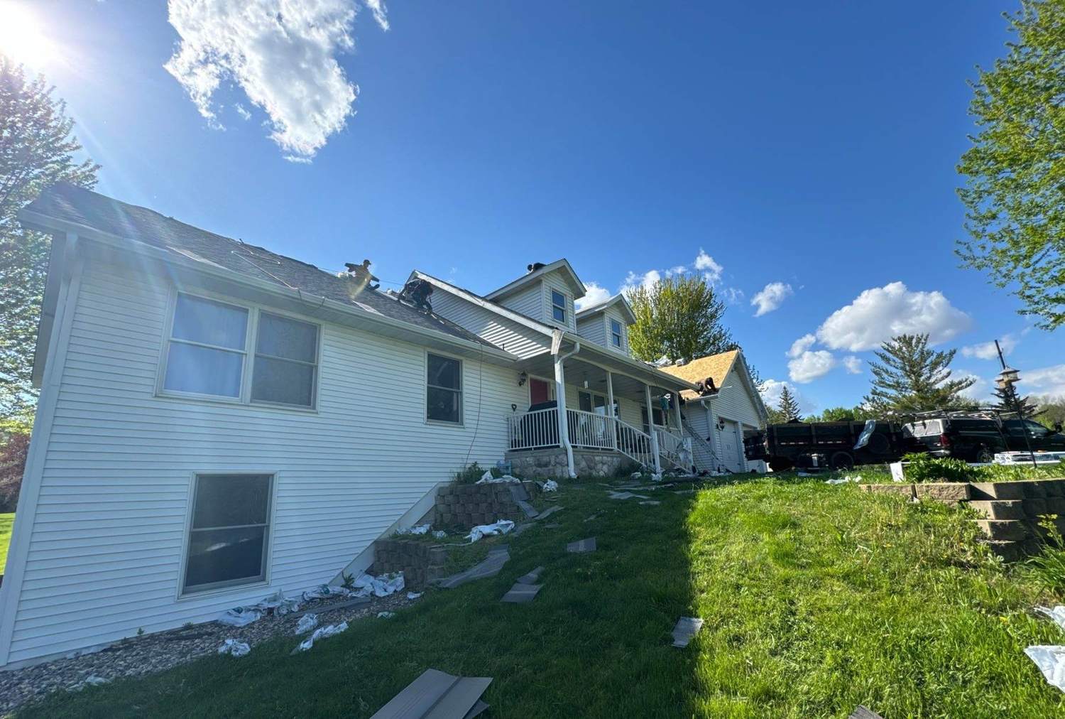 Repair King crew tearing off and re-shingling a home near Dassel, MN, May 2024