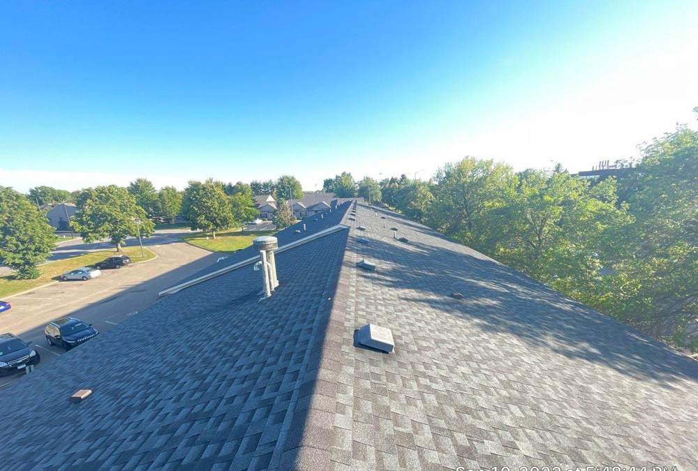 Aerial view down the shingle roof of the Coratel Inn in Maple Grove, MN during a Repair King inspection