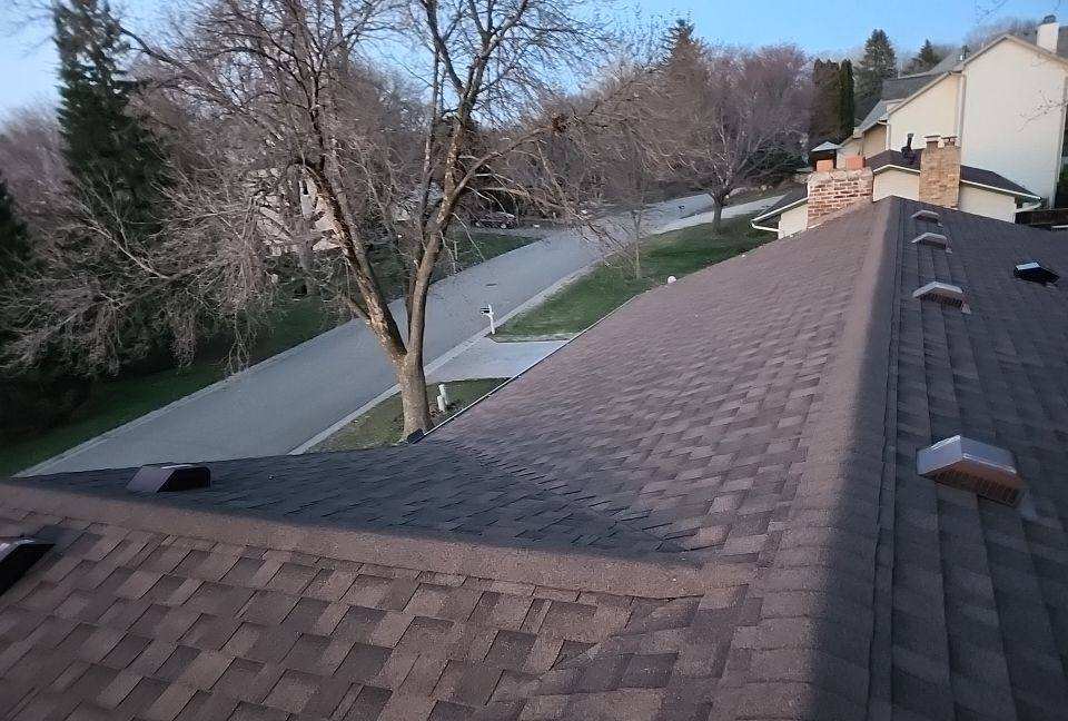 View down a Maplewood roof ridge toward the street below, April 2023