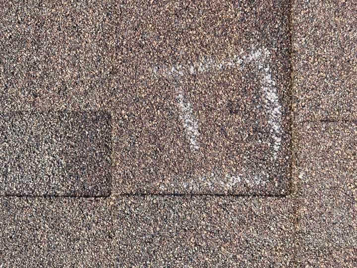 Chalk-outlined test square on a shingle slope at Pinecone Villas townhomes in Sartell, MN, September 2021