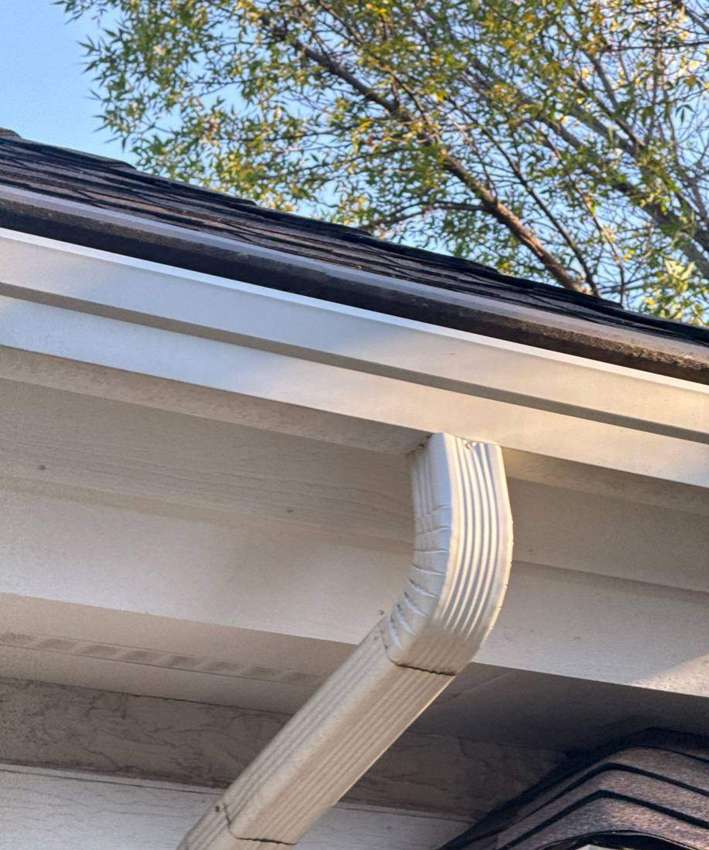 Downspout and gutter corner on a Burnsville home, October 2025