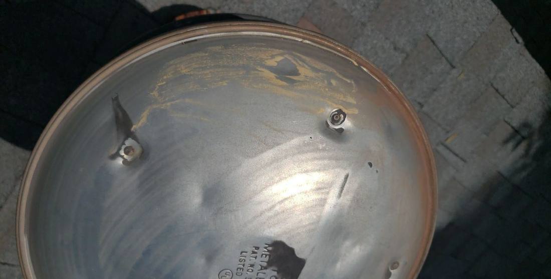 Dented metal roof vent cap found on a Woodbury inspection, June 2022