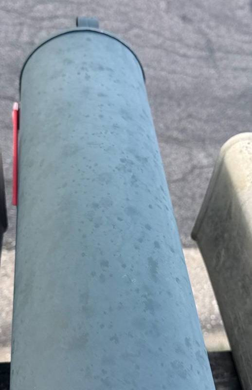 Same property: hail spatter on the mailbox, a clue you can check from the ground
