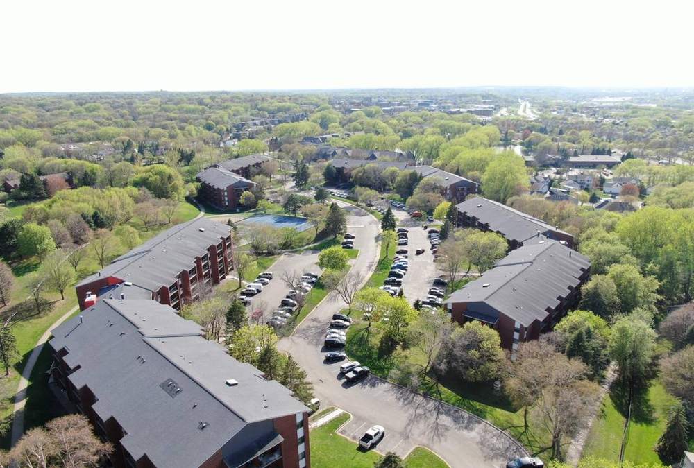 Aerial view of the Twelve 501 apartment community roofs near downtown Burnsville, May 2023