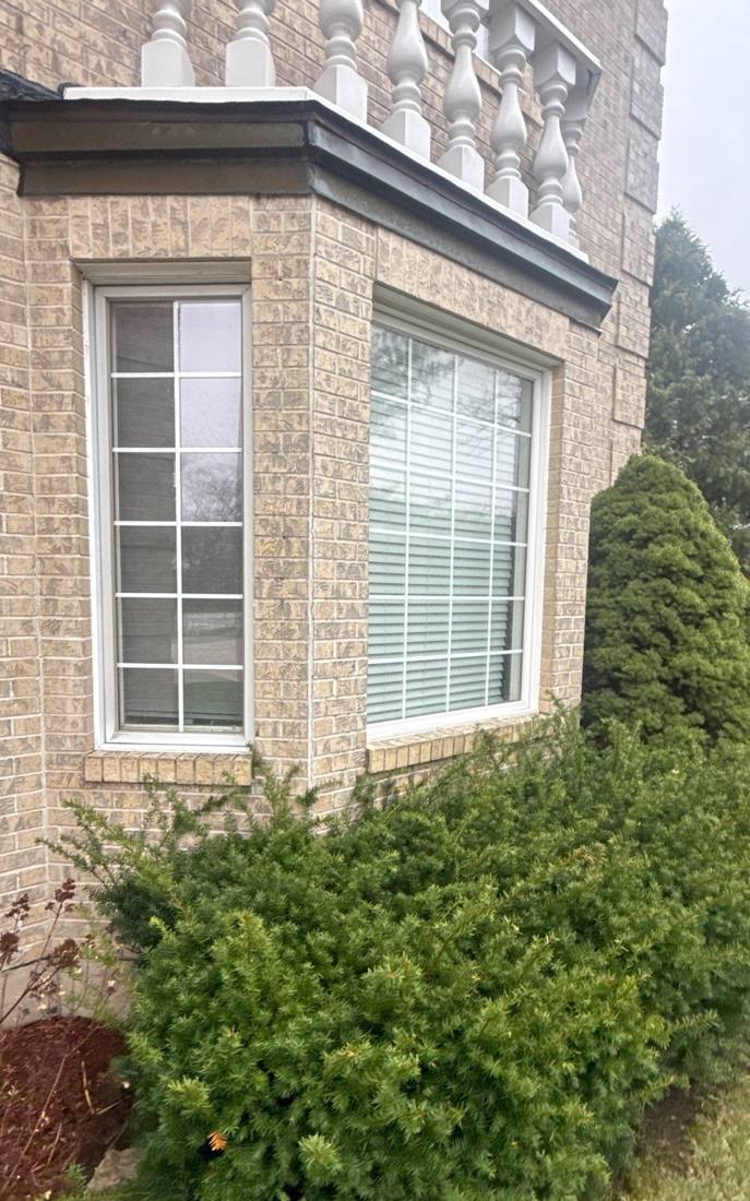 Window seal checked for wear during a Burr Ridge roof inspection, April 2026