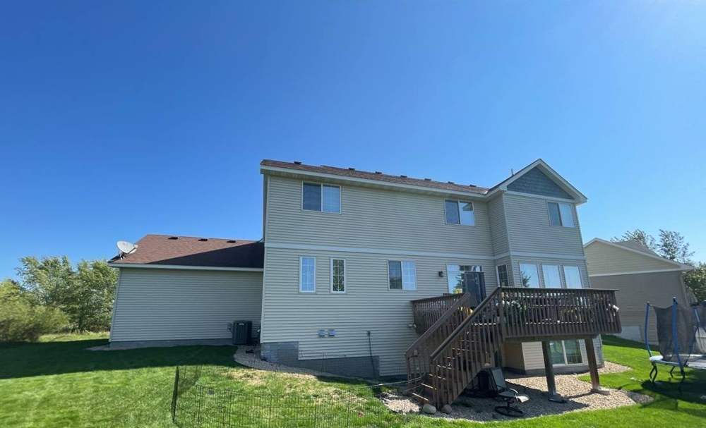 Rear of a two-story vinyl-sided home in St. Cloud, MN during a Repair King storm inspection, September 2021