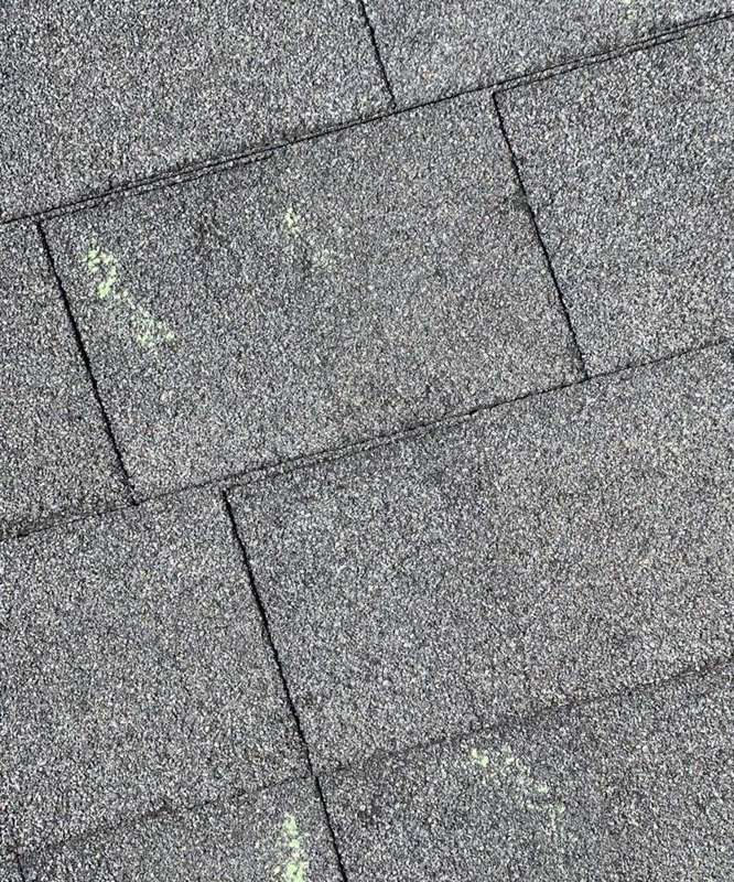 Hail hits chalk-marked on a Mankato roof slope during an inspection, April 2022