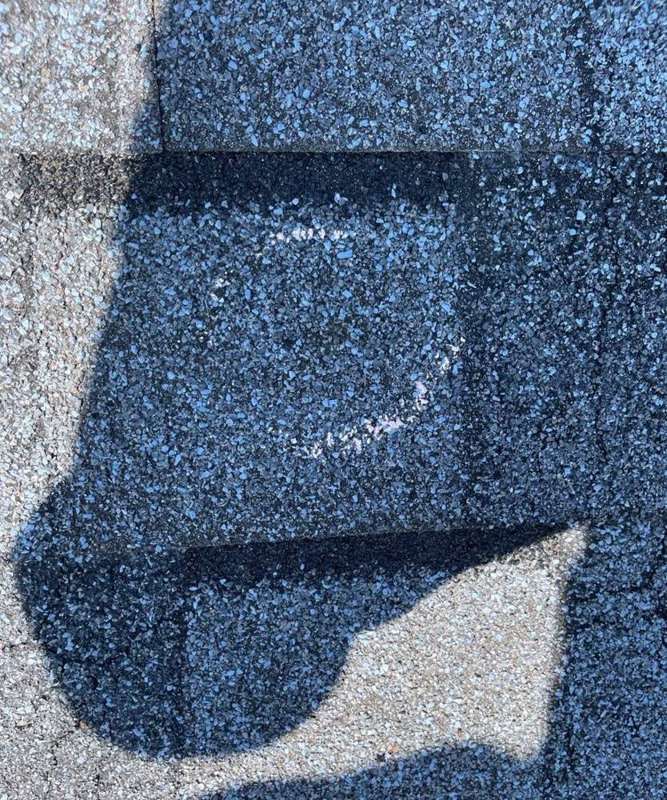 Chalk-marked hail hit on the shingle roof at Waite Park's Culver's, September 2021