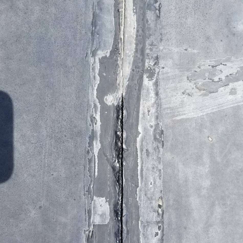 Open seam in the black rubber roof membrane at King of Glory Lutheran Church in Blaine, MN, July 2017