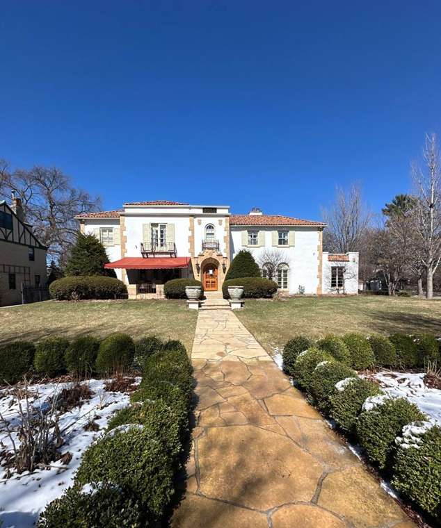 Mediterranean-style stucco home with a red clay tile roof on West Summit Avenue in St. Paul, photographed by Repair King during a tile roof repair, March 2025