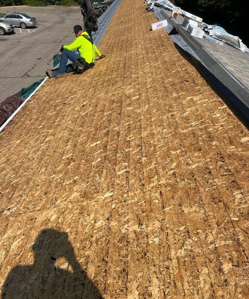 Repair King crew working on exposed roof decking during the Ridgedale Square Apartments tear-off in Hutchinson, MN, September 2024