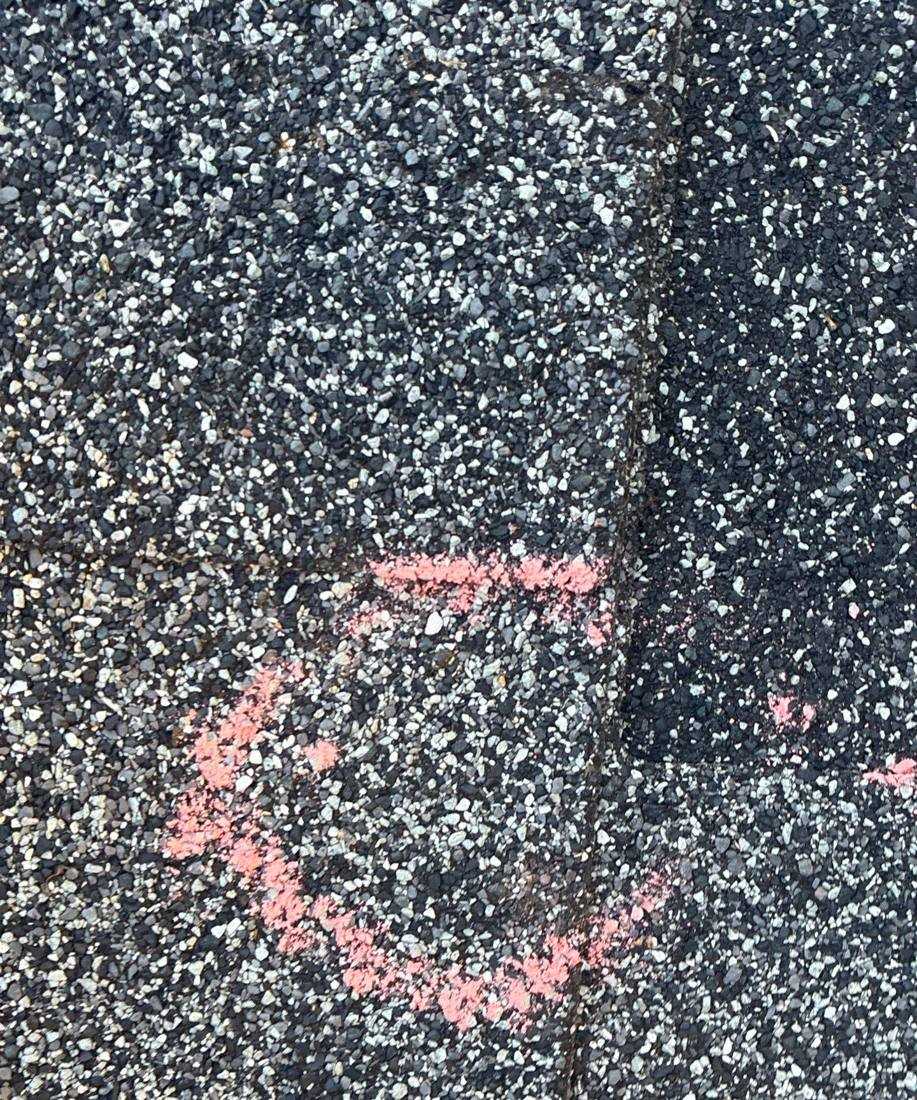 Hail hit chalk-marked on an Oakdale roof slope during an inspection, June 2026