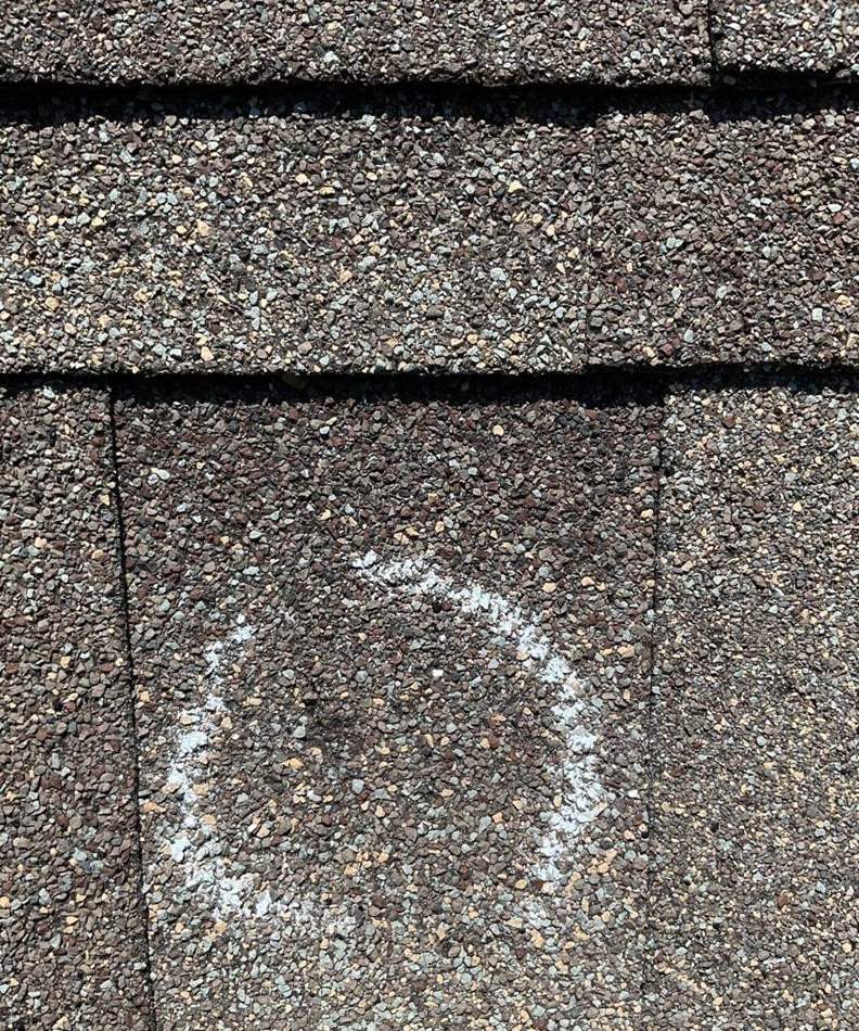 Hail hit chalk-marked on a Randolph roof during a storm inspection, July 2023