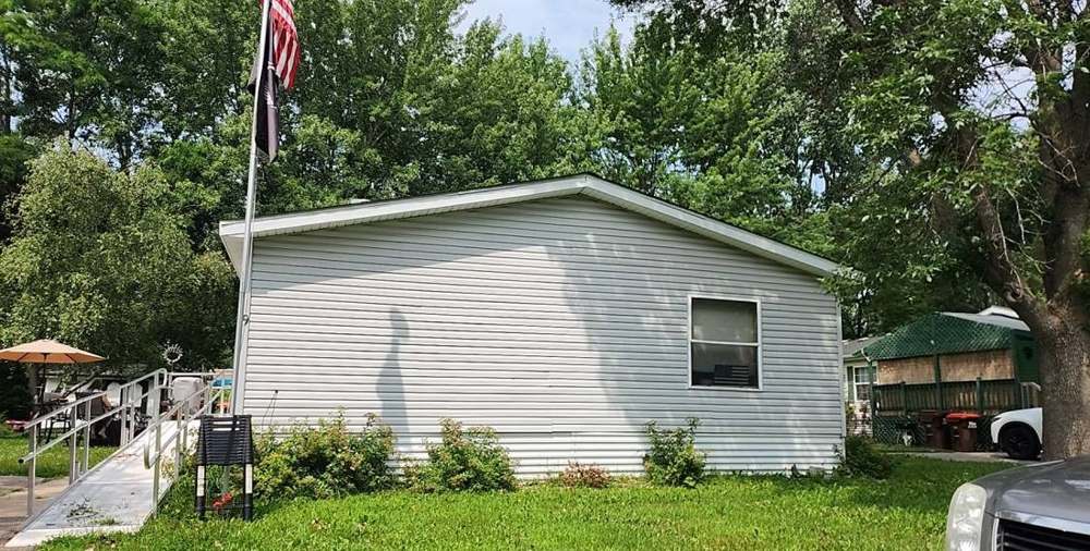 Manufactured home photographed during a Hastings roof inspection, July 2023