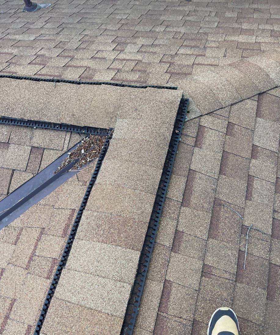 Open ridge and gutter work during a roof inspection near Prairie Road, July 2022