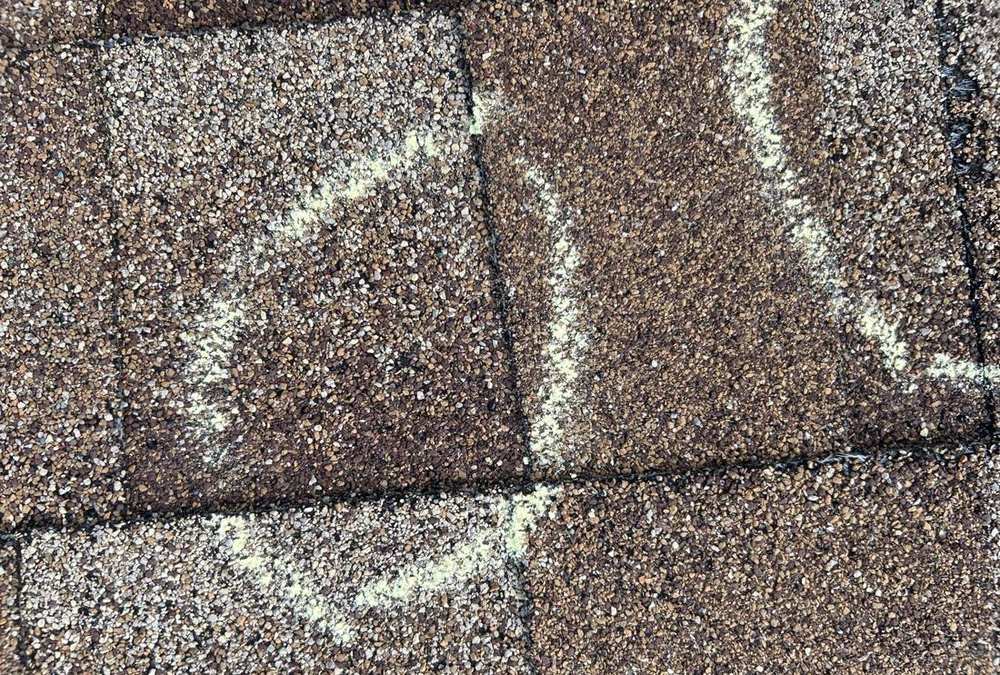 Chalk-marked hail hit on a Roseville roof slope, August 2025