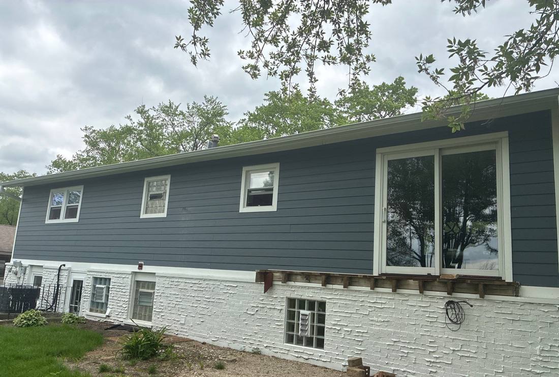 Rear elevation of a Downers Grove home with new siding installed, April 2026