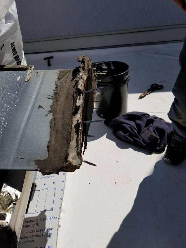 An opened rooftop curb on the new white membrane, ready to be flashed, at the Forest Lake dealership