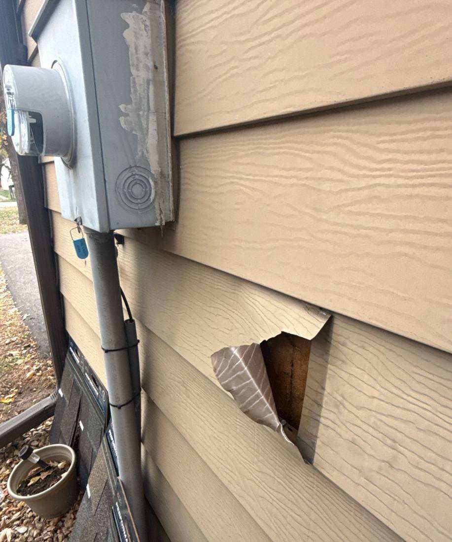 Storm-damaged siding found during a White Bear Lake inspection, October 2025
