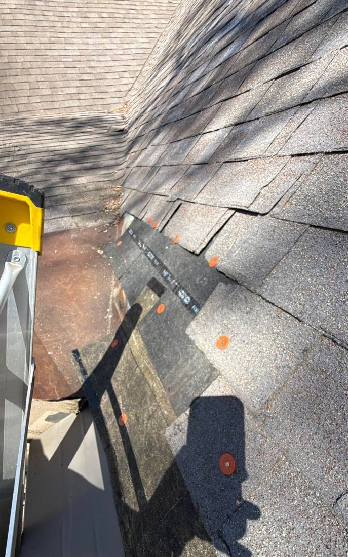 Hail hits marked along a Downers Grove roof valley during an inspection, May 2026