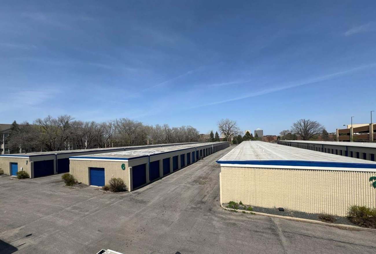 Rows of single-story self-storage buildings with low-slope membrane roofs at iStorage SLP on Cedar Lake Road in St. Louis Park, MN, inspected by Repair King in April 2024