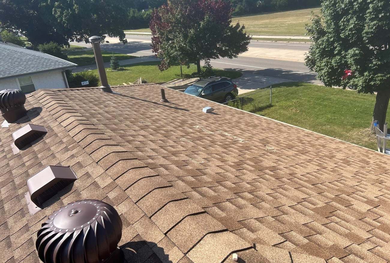 Aerial view of a shingle roof with chalk-marked hail hits in Inver Grove Heights, MN, photographed by Repair King in August 2025