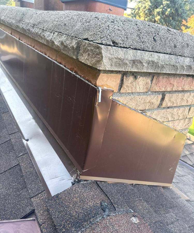 New copper-style chimney flashing on a Roseville roof, October 2025