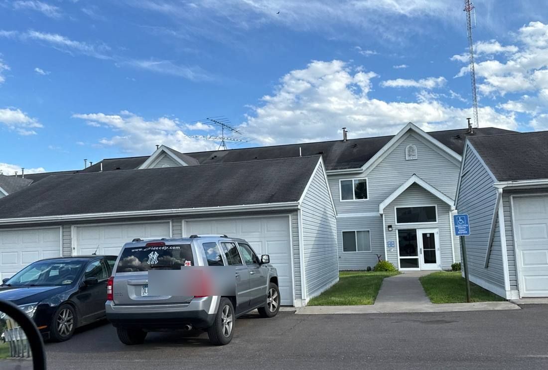Row of townhome garages at Wild River Townhomes in Sandstone, June 2024