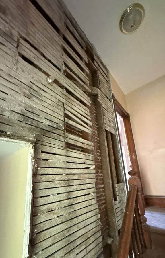 Interior gutted and dried after fire damage in a South Minneapolis home, before rebuild