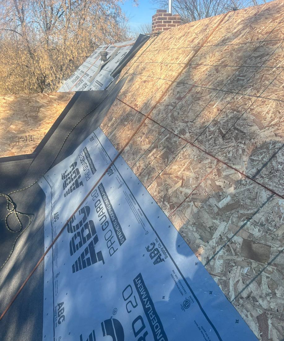 Synthetic ice-and-water underlayment going down on a Cottage Grove re-roof, October 2022