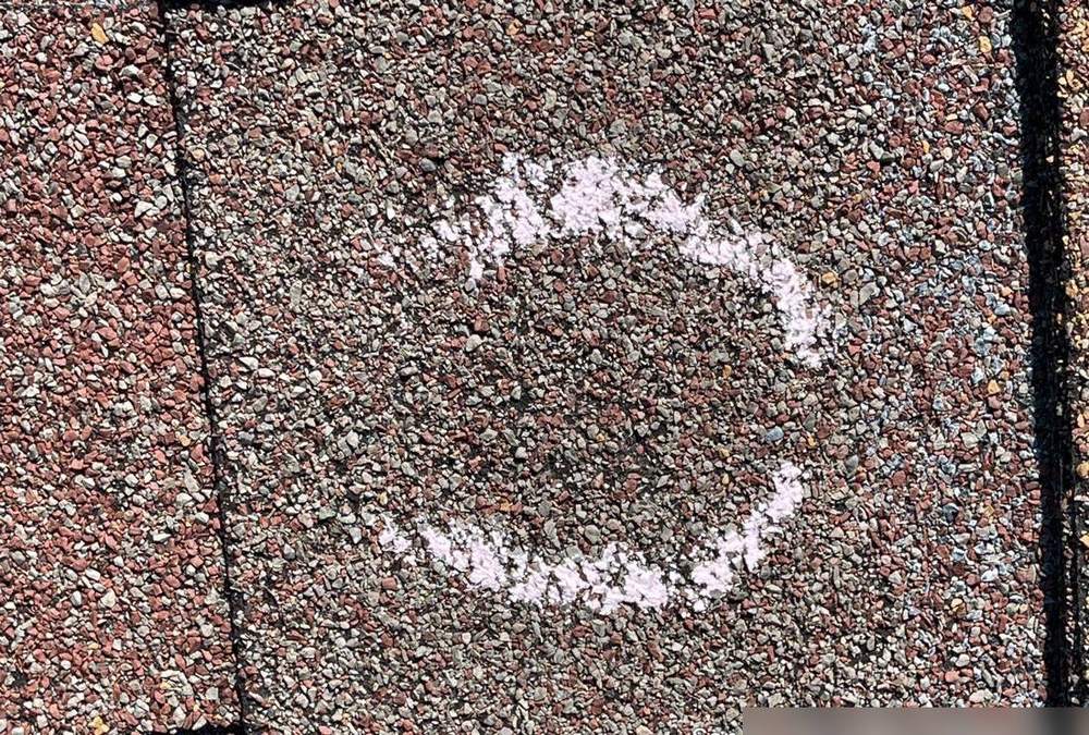 Hail hit chalk-marked on a St. Cloud roof during an inspection, September 2021
