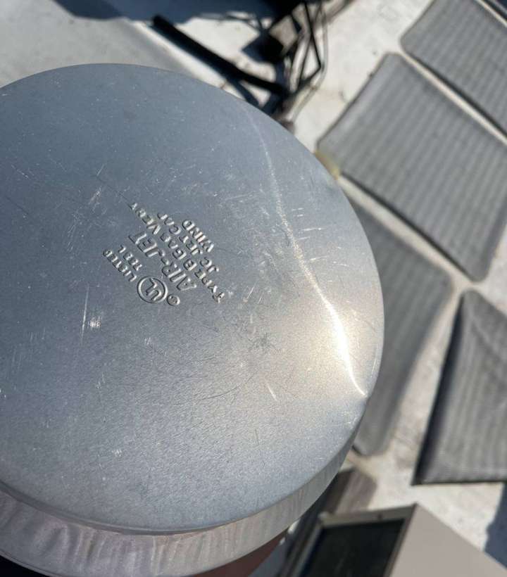 A metal exhaust cap on the Culver's flat roof, photographed up close