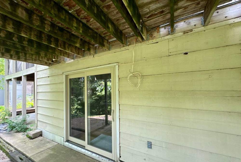 Woodpecker damage found on a Maple Grove home's siding during a roof and exterior inspection, June 2024