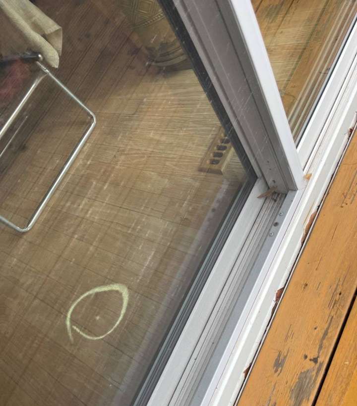 A chalk circle on a patio door frame at a Sauk Rapids home, October 2021