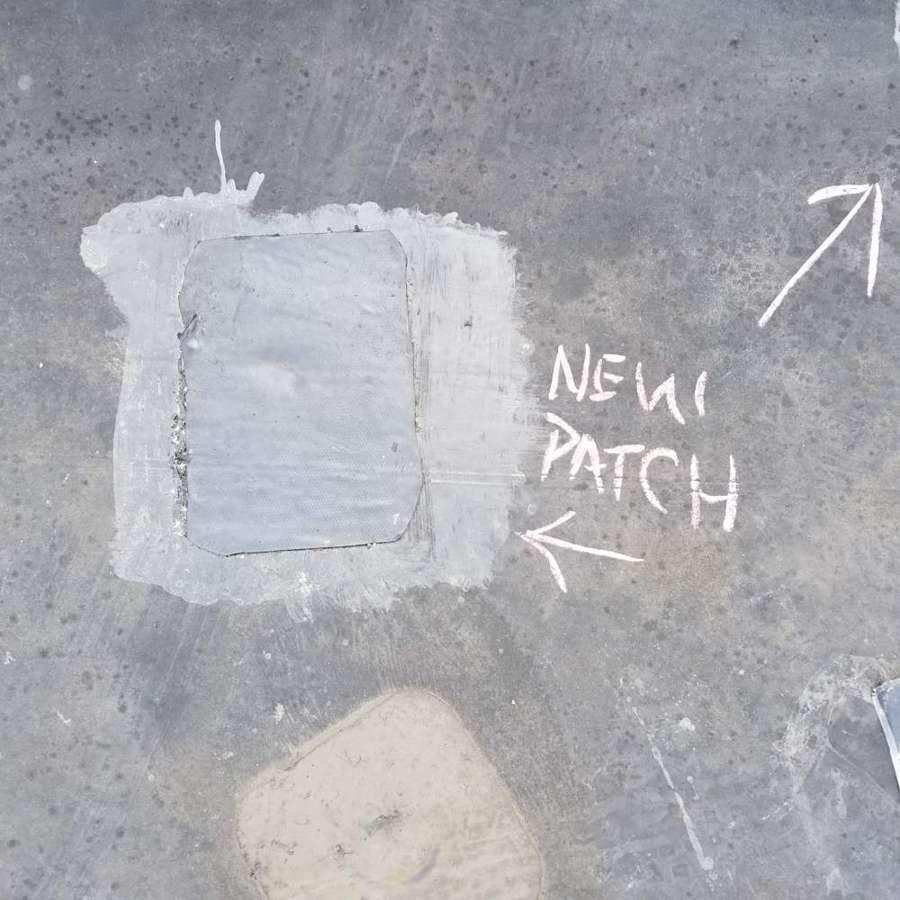 An earlier patch on the membrane, chalk-marked during our roof walk in West St. Paul