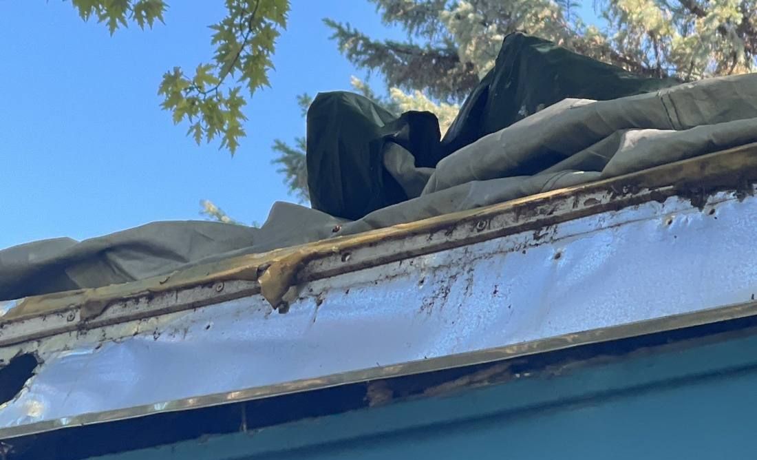 Torn roof edge flashing and covering found during an Eagan roof inspection, September 2021