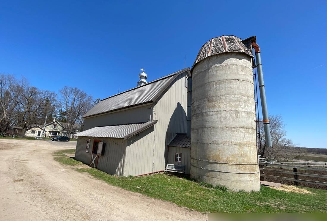 Dairy barn and silo on a farm near Royalton, photographed during a roof inspection, May 2022