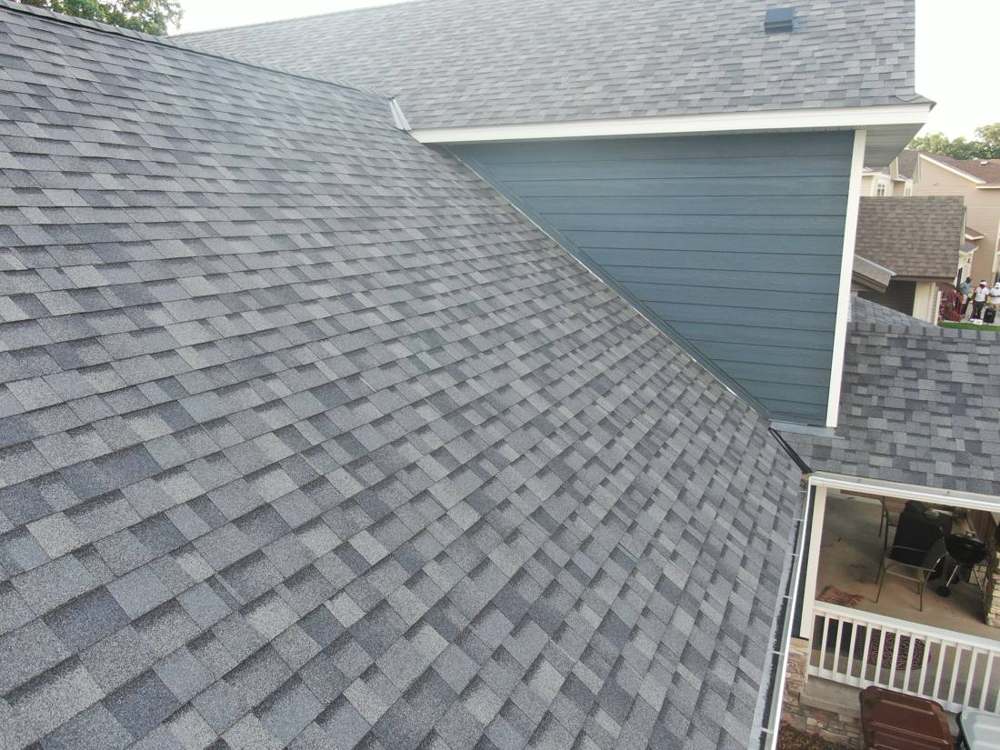 New shingles meeting the new lap siding on a Ramsey home, July 2019