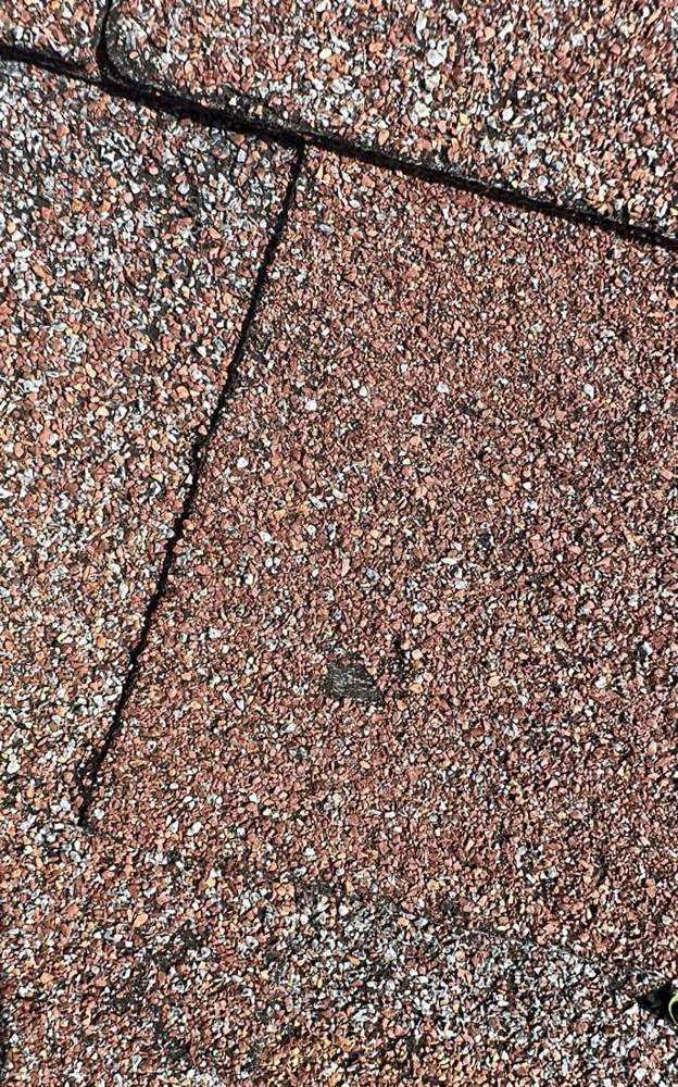 Close-up of architectural shingles on a newly finished Dennison roof, July 2023