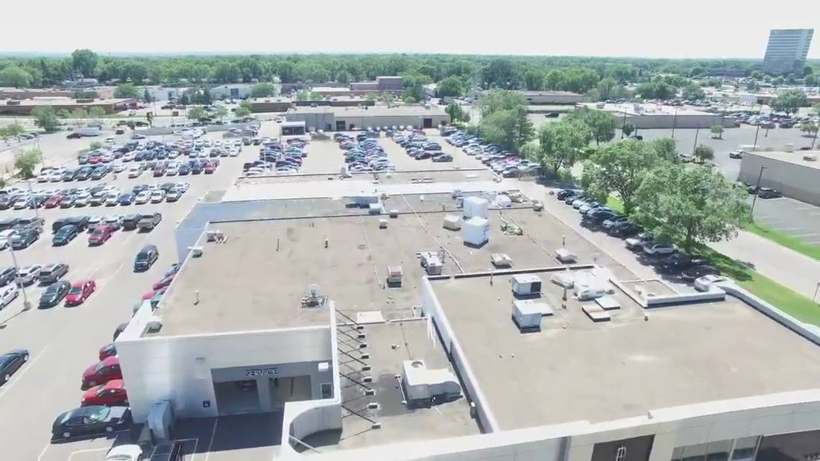 Drone view of the flat roof and rooftop units on the Bloomington Lincoln dealership at 7800 Dupont Ave S in Bloomington, MN, just south of Richfield