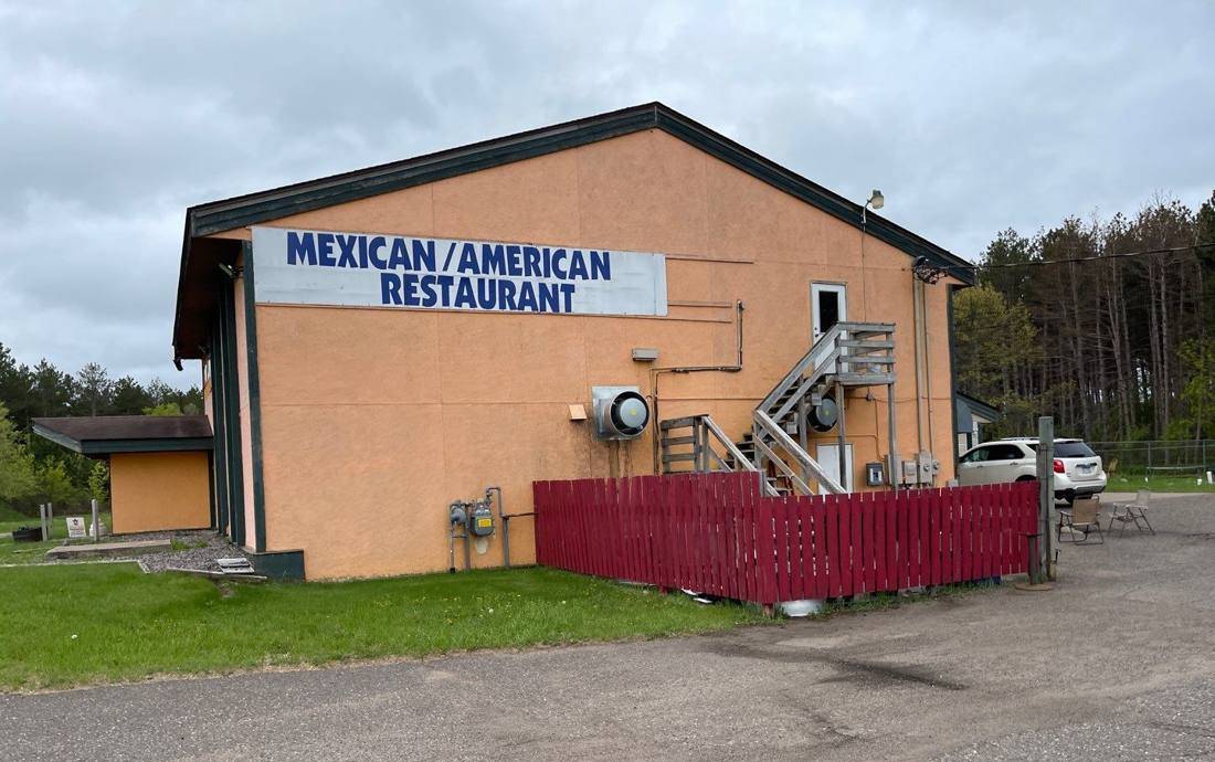 Side elevation of the Madre Loca restaurant building showing its "Mexican/American Restaurant" sign, Princeton, May 2022