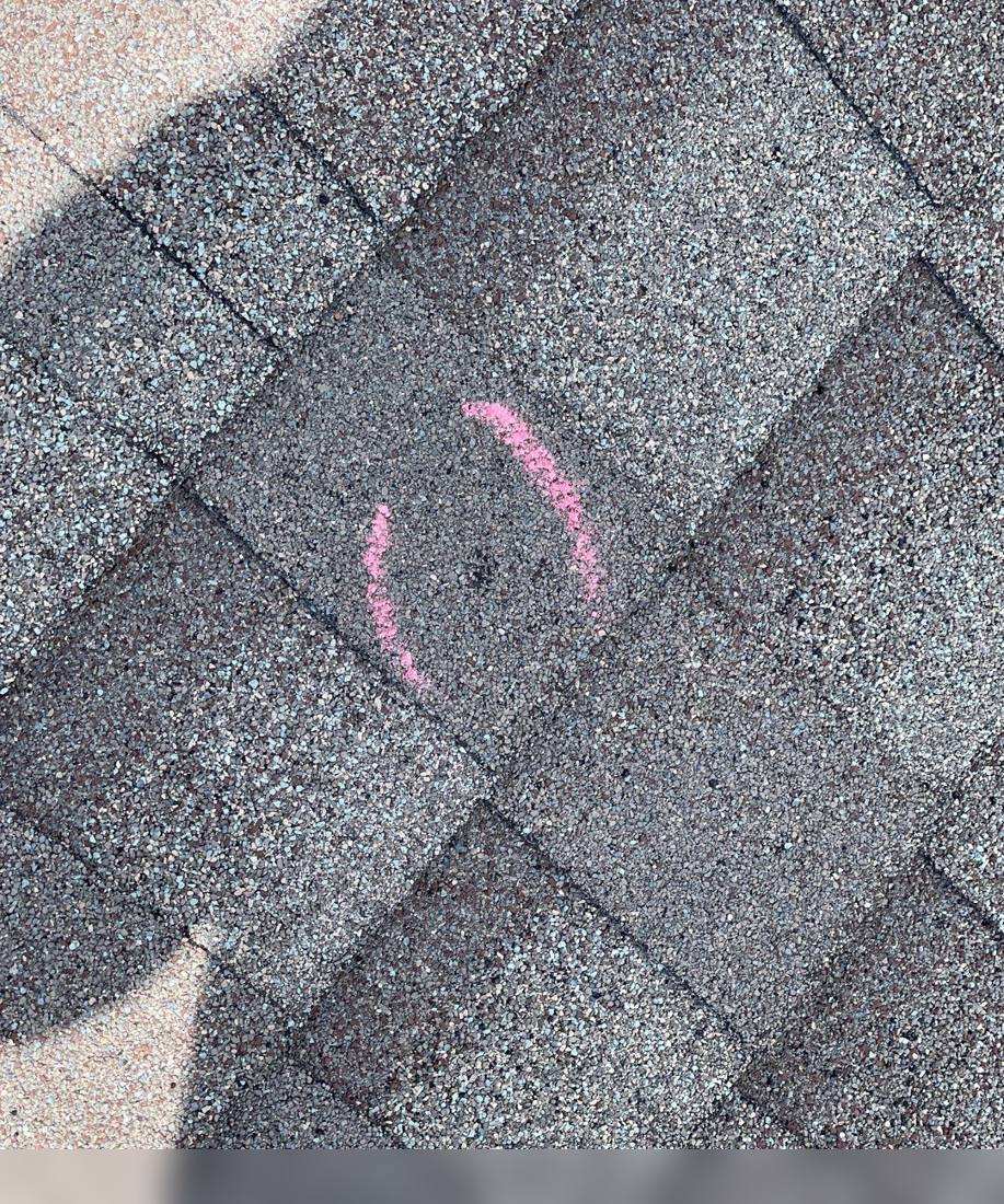 Hail hit chalk-marked on a Bowlus roof during an inspection, May 2022
