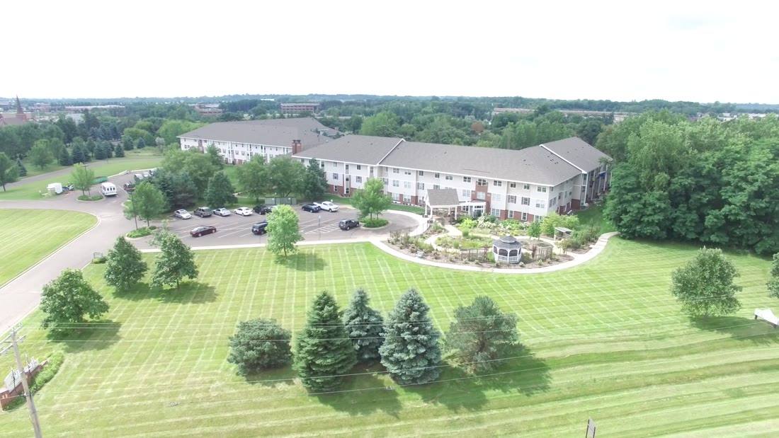 Drone photo of Oak Meadows Senior Living in Oakdale, MN, a three-story senior residence where Repair King did siding and roofing work