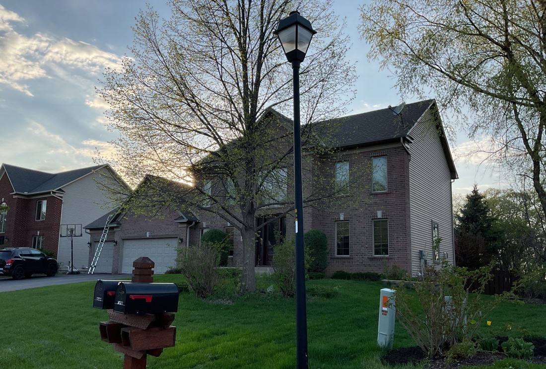 Savage home at dusk photographed during a roof inspection, May 2023