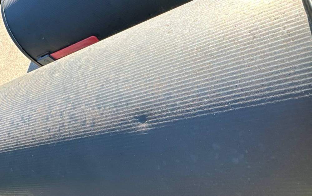 Hail dent found in a Minnetonka gutter during an inspection, June 2024